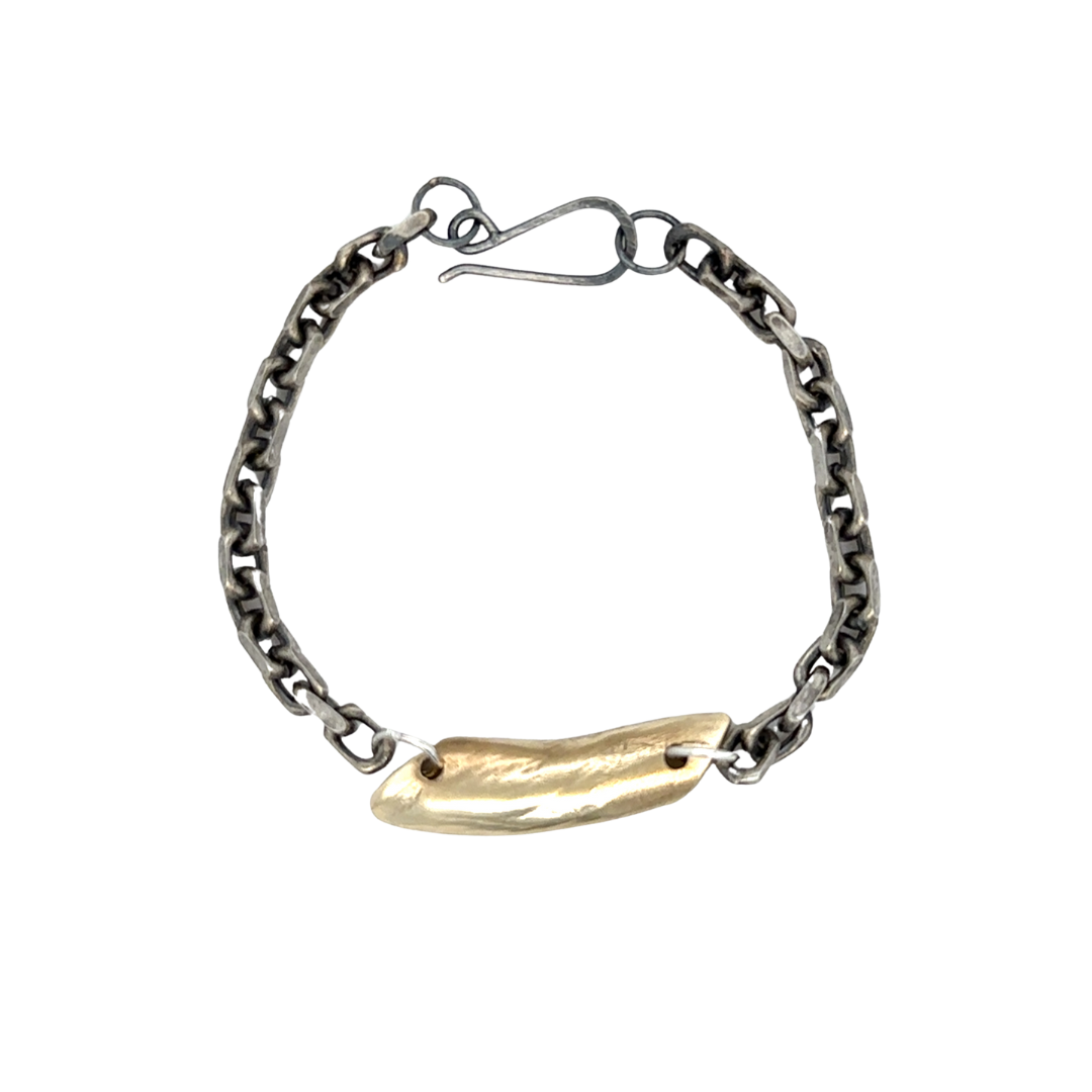 The Pulse Chain Bracelet anchors strength and grace at your wrist. A bold oxidized chain is centered with a hand-sculpted form that is raw, organic, and full of quiet power.