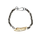 The Pulse Chain Bracelet anchors strength and grace at your wrist. A bold oxidized chain is centered with a hand-sculpted form that is raw, organic, and full of quiet power.