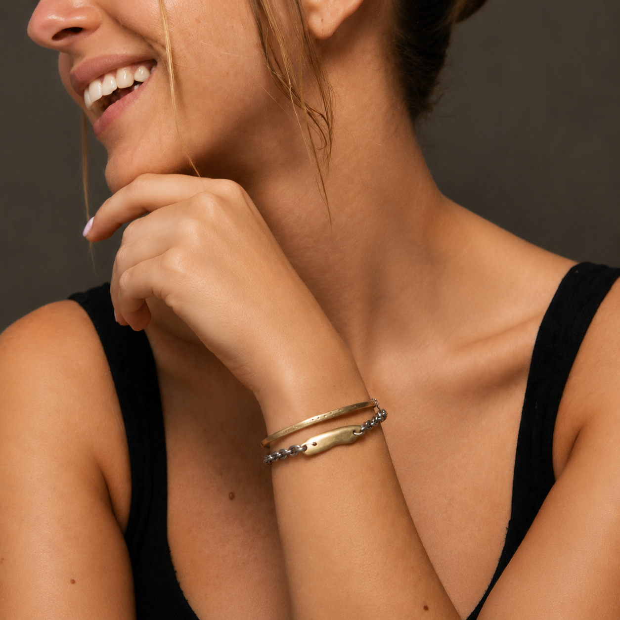 Model wearing Pulse Bracelet in Bronze + Skipping Stones Simple Bracelet in Bronze with Black Diamonds