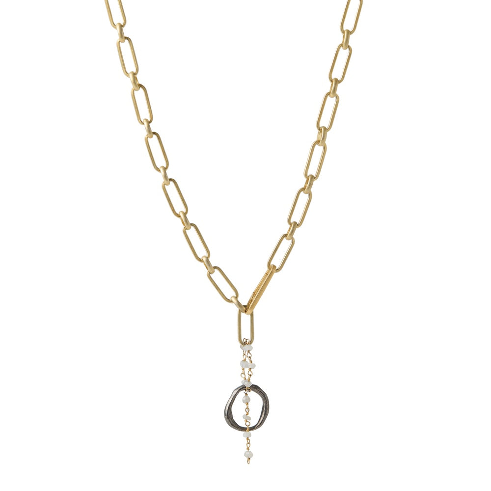 The Celestial Orbit Necklace with 14k gold plate chain links represent the structured path of the sun and captures the moon's intuitive rhythm. While the moonstones in this piece do more than catch the light – they actively work to balance your emotional body. 