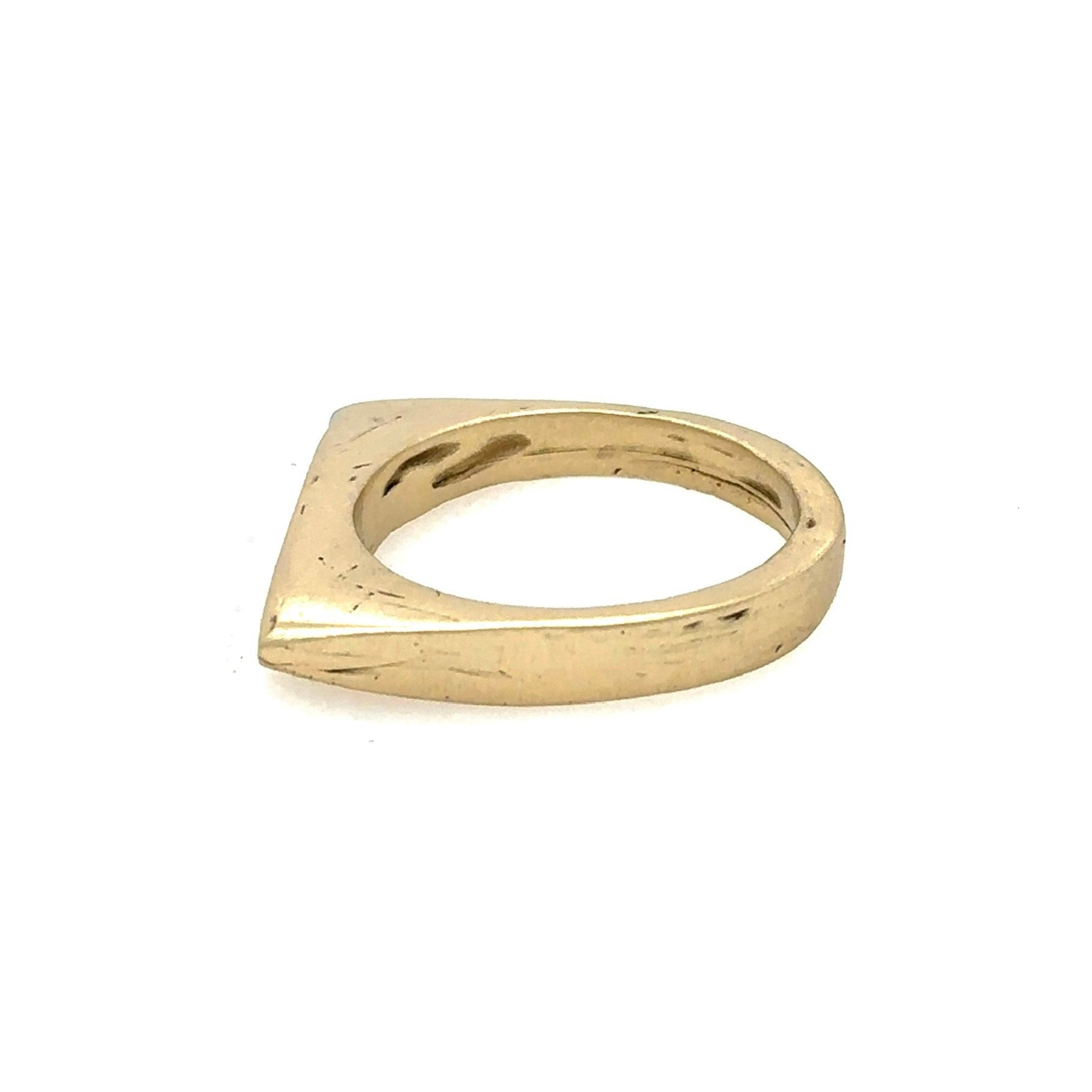 In the most profound moments of transformation, everything is stripped to its essence.This sleek, architectural band captures that moment of clarity with its refined silhouette and single black diamond - like the dark center of an eclipse where revelation occurs in shadow.