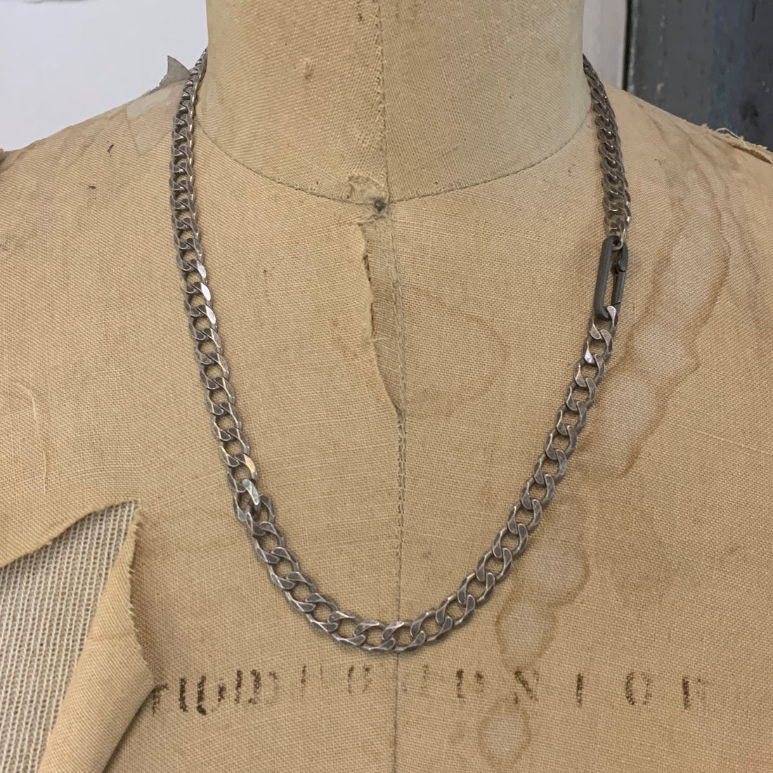  The large links, weight and texture of this flat curb chain have it all. This is the perfect chain to layer with other chains, wear solo, or use the Paperclip Connector & add a few of your favorite Talisman.  