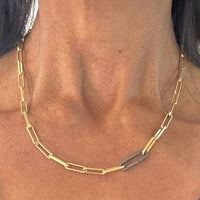 A lux chain for gold lovers! The even links of 18 kt gold plate brighten all skin tones and the oxidized silver paperclip connector adds that edge. Ideal as a single chain, but we love it layered with Talisman!