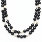 Close up of the Tiffany & Co. Black Onyx, Pearl and Gold Beaded Necklace in the Chikahisa Ancestor Collection. 