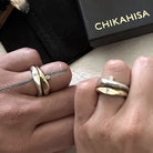 Couple wearing the Odyssey and Channel Rings 