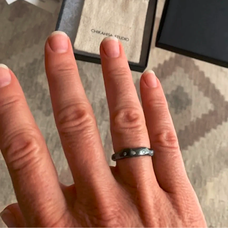 Hand wearing Deep Mystic Ring with Diamonds 