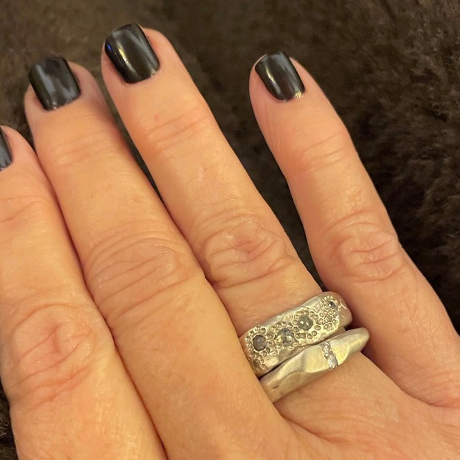 Thrive Ring with Channel Ring in Silver shown on hand 