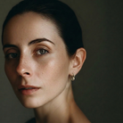 The Cell Stud Earrings from the Hive Collection on a Model