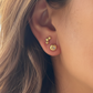 Evil Eye Stud Earrings n 18kt Gold and Hoshi Stud Earrings in 18kt Gold on a person 