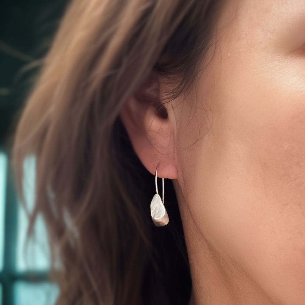 Echo Earrings in Silver on a person 