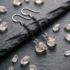 Fracture Earring on dark background up close