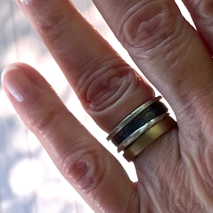 Close up of Elemental Harmony Ring stack on hand