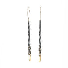 The Horizon Earrings are movement and light in harmony. An oxidized silver chain sways gracefully, ending in a luminous 18kt gold link that shines like the rising sun. They capture the essence of awakening - shadow giving way to brilliance.