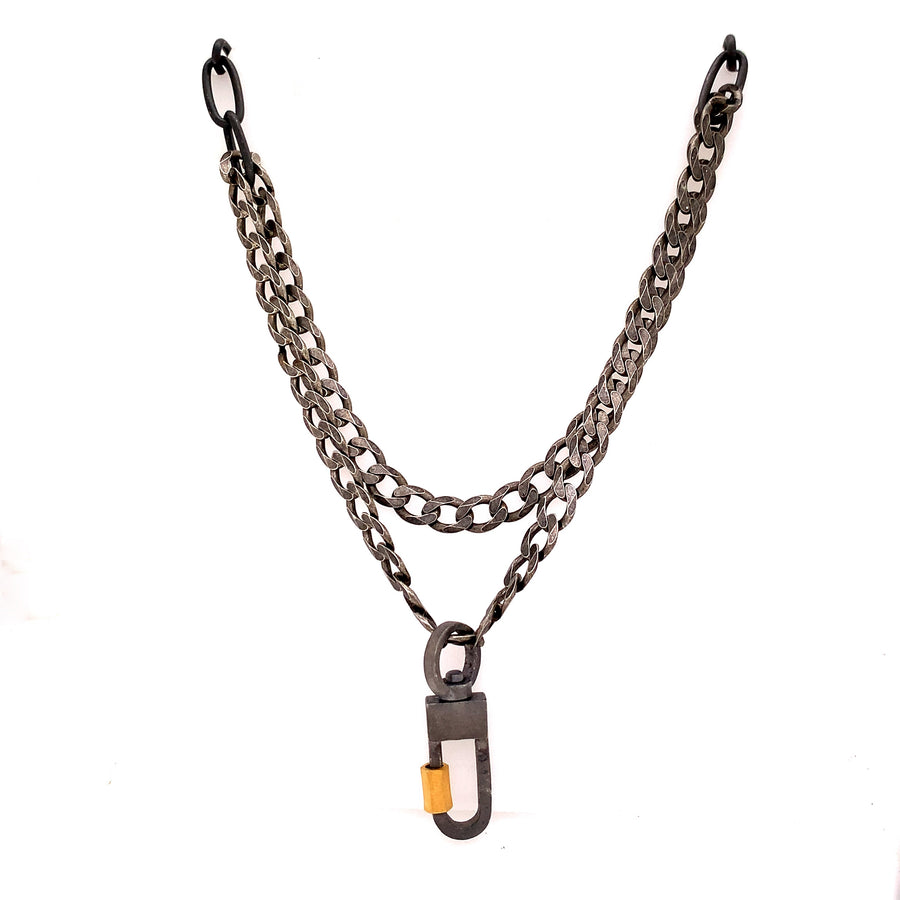 We've combined two cool oxidized sterling chains - one is a chunky flat curb & the other a large link oval on this layered necklace. You can add a few Talisman to the Sterling Lock Connector and turn up the volume!