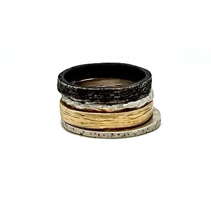 This stacked ring collection features all four elements making you a beacon of balance and unstoppable force. Fire ignites your passion, Water keeps you cool under pressure, Air fuels your ambitions, and Earth grounds you with unwavering strength. Basically, it's like having your own personal spirit guide on your finger.