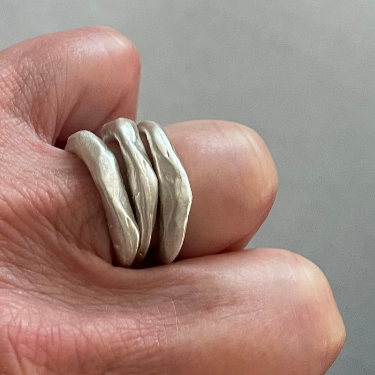 Alchemist Stacking Rings Silver shown on hand 