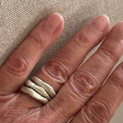 Alchemist Stacking Rings Silver shown on persons hand