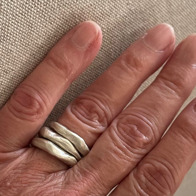 Alchemist Stacking Rings Silver shown on persons hand
