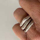 Close up of Alchemist Stacking Rings Silver shown on  hand
