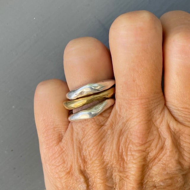 Alchemist Stacking Rings Combination 2 shown on persons hand 