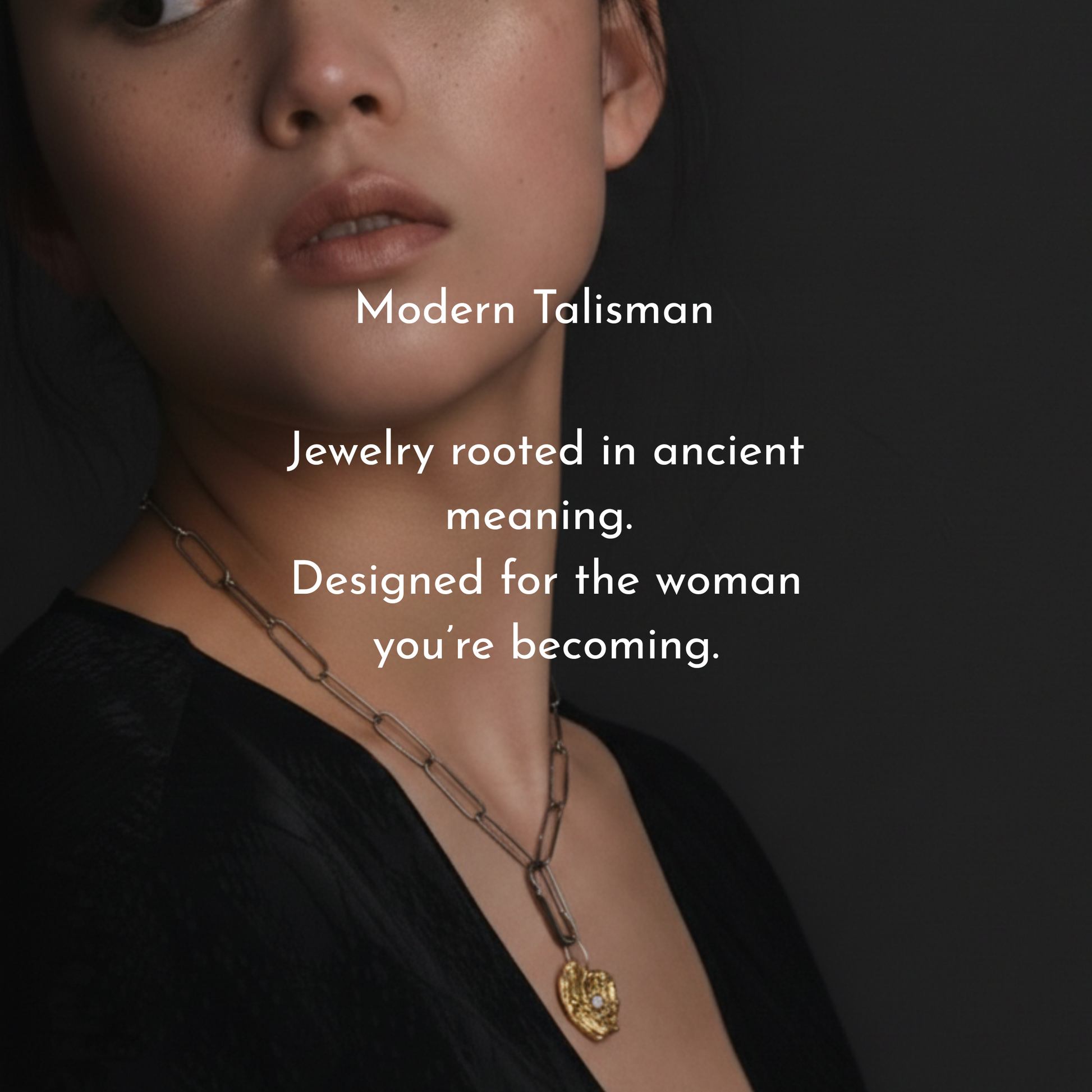 Person wearing Love Talisman Necklace with text about 'Modern Talisman' jewelry on a dark background