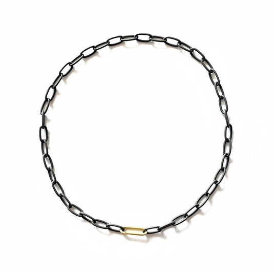 When you wear the Large Link Black Silver Chain with Paper Clip Connector, you're immediately infused with a sense of cool confidence. There's a subtle rebellious thrill in wearing something so unconventional yet effortlessly chic. 