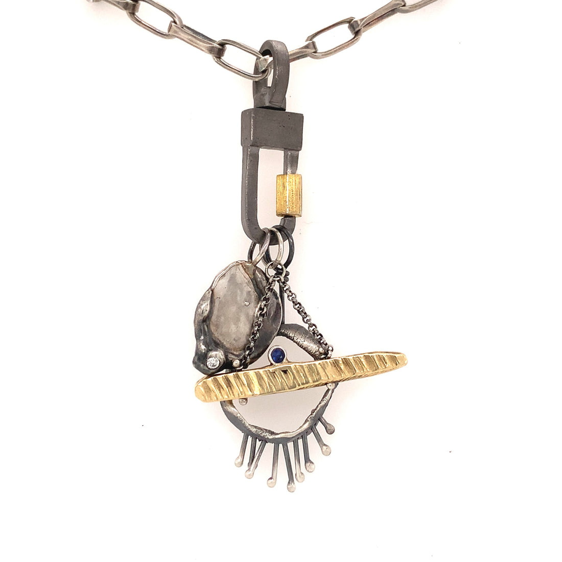 The Lock Connector is made of solid sterling silver with a 18k gold-plated screw closure and is made to swivel so your Talisman Pendants will move with your body.