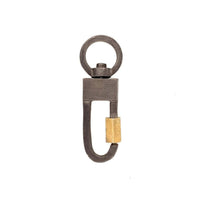 The Lock Connector is made of solid sterling silver with a 18k gold-plated screw closure and is made to swivel so your Talisman Pendants will move with your body.