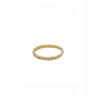 In Zen Buddhism, mushin (無心) describes a state of "no-mind" - when the self dissolves and conscious thought gives way to pure awareness. It's the perfect moment when an archer releases the arrow, when a calligrapher's brush moves without hesitation, when clarity emerges from the space between thoughts. Our 18kt Gold Mushin Ring with thirteen precisely set diamonds embodies this elusive state of perfect attention.