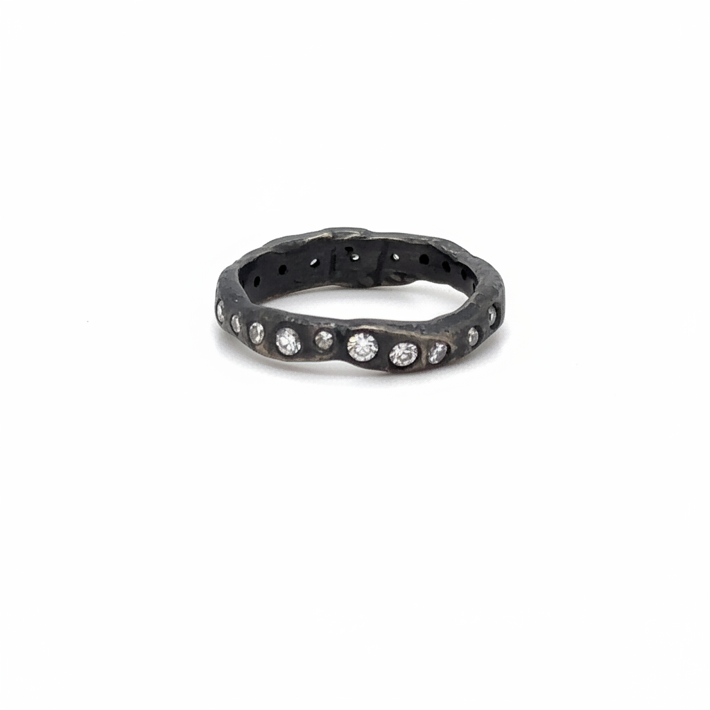 The Mystic Radiance Ring is a luminous ring of white diamonds set in oxidized silver. Inspired by starlight and transformation. Your inner light, revealed.