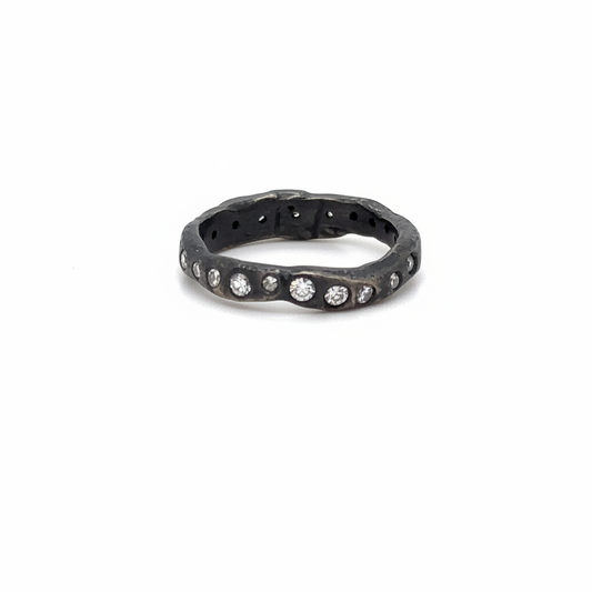 The Mystic Radiance Ring is a luminous ring of white diamonds set in oxidized silver. Inspired by starlight and transformation. Your inner light, revealed.