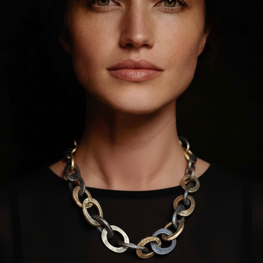 The Illumina Link Necklace is a bold mixed-metal necklace in bronze and oxidized silver. Hand-sculpted links celebrate strength, connection, and wabi-sabi beauty.