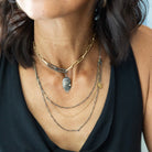 A delicate and stunning necklace! Get the look of layers in one simple beauty with the Layered Necklace in Mixed Metal. Shown with the Modern Gold Link Chain with Double Paper Clip Clasp and Desire Talisman.