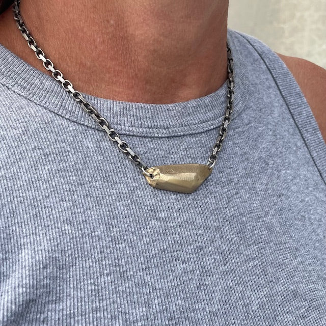 Vestige Necklace in Bronze on a person 