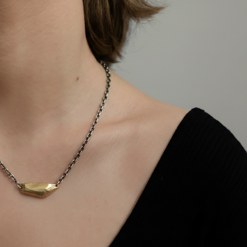 Model wearing Vestige Necklace in Bronze