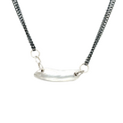 The Whisper Necklace rests softly at the nape of your neck, like a secret promise you carry close. A sculptural form anchors dual oxidized silver chains and it's raw edges are a reminder of the beauty that emerges from imperfection.