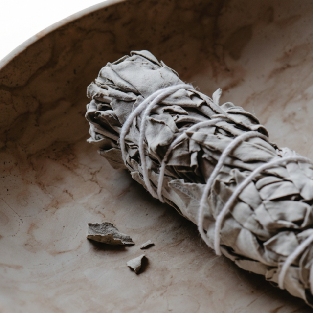 Sage bundle wrapped in twine in a bowl