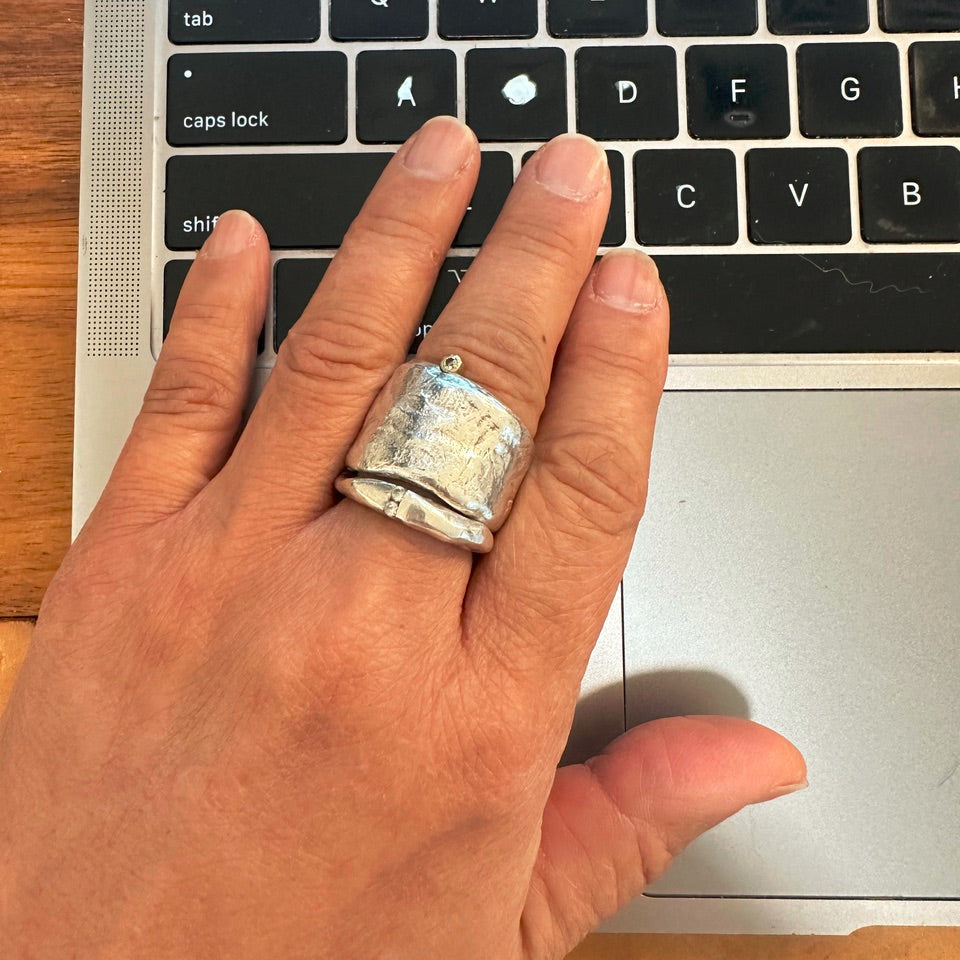The Channel Ring in silver and Relic Ring in Silver shown on persons hand 