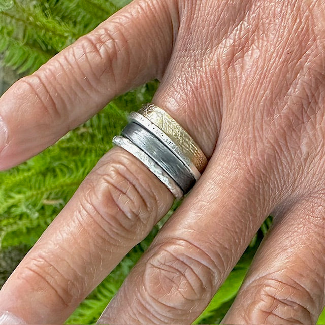 This stacked ring collection features all four elements making you a beacon of balance and unstoppable force. Fire ignites your passion, Water keeps you cool under pressure, Air fuels your ambitions, and Earth grounds you with unwavering strength. Basically, it's like having your own personal spirit guide on your finger.