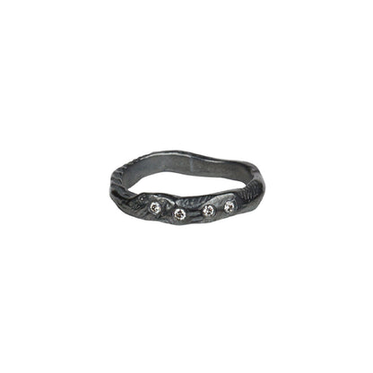 The Deep Mystic Ring with Diamonds is a sculptural addition to any ring stack! The art of wabi-sabi is reflected in its organic shape, texture and dark oxidized finish. Reminding us of the beauty found in imperfection. 