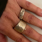 The Thrive Ring with Salt & Pepper Diamonds and the Relic Ring in Silver shown on persons hand 
