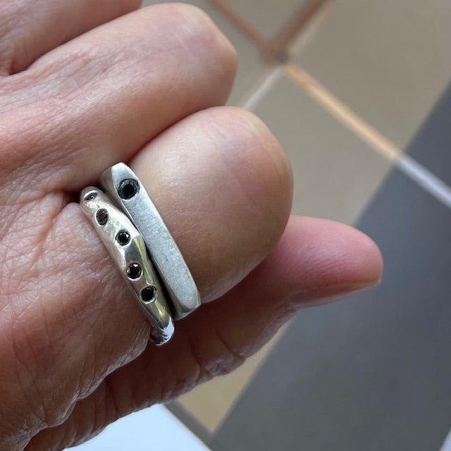 Lunar Eclipse Ring in silver with the Constellation Ring in Bronze shown on a person