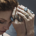 Model wearing Gemstone Rings, Ovum Ring, and Stack of Chikahisa Studio Rings