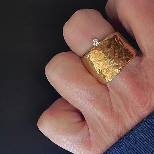 Close up of the Relic Ring in Bronze on persons hand