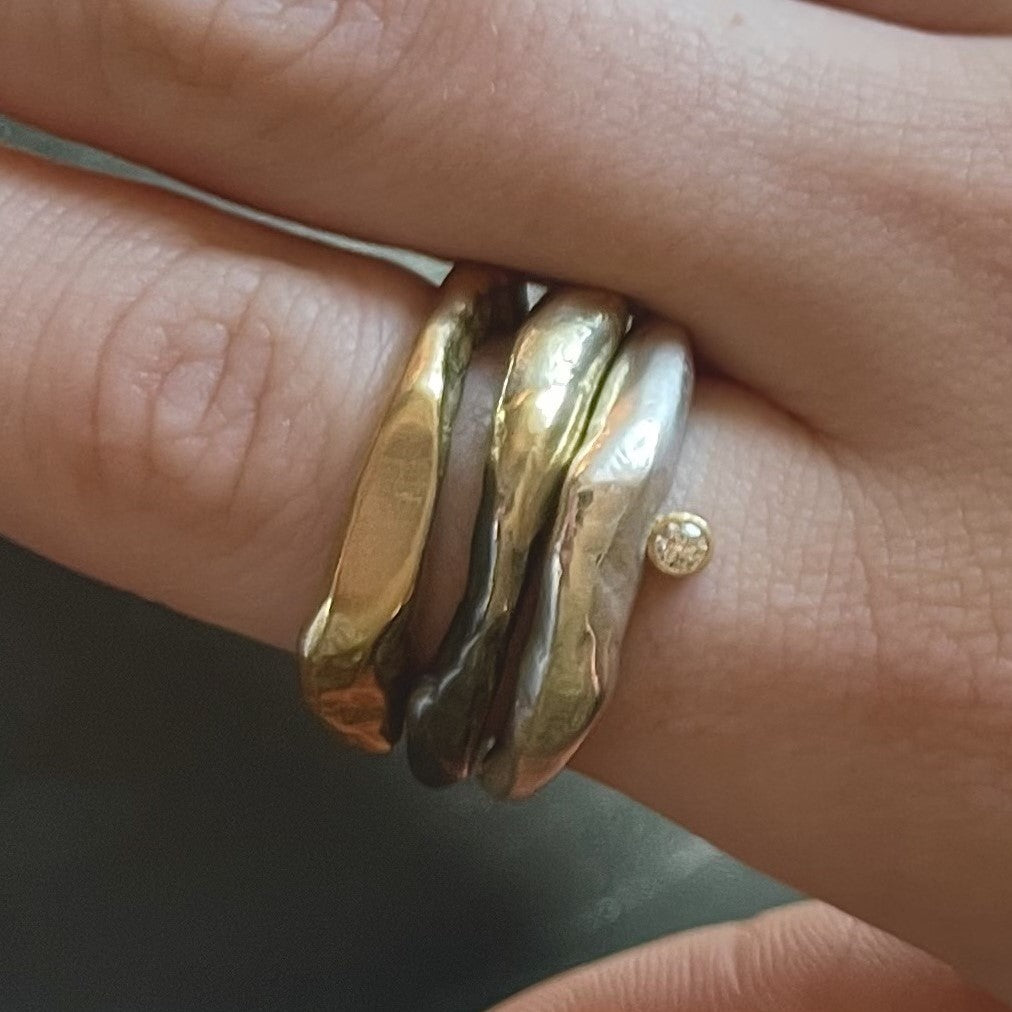Close up image of 3 rings on a hand