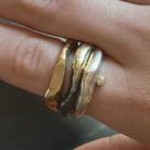 Close up image of 3 rings on a hand