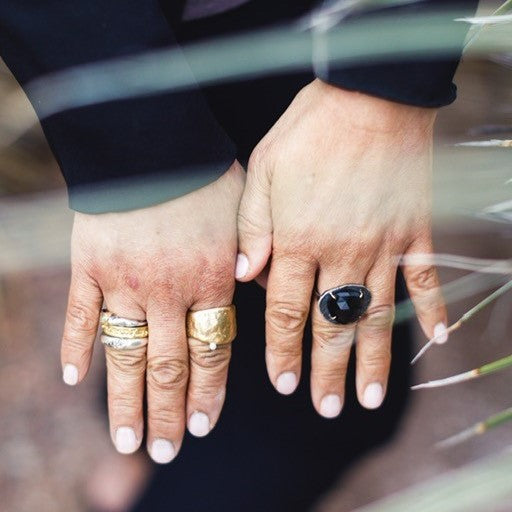 The Relic Ring in Bronze on persons hand along with other Stacked Rings by Chikahisa Studio 