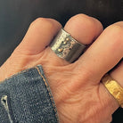 Tidal Pool and Rebel Ring in Bronze shown on persons hand 