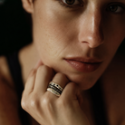 Constellation, Mystic Radiance, and Channel Ring shown stacked on model's hand