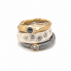 Ring stack featuring (top to bottom) Devotion Ring in Bronze w/Black Diamond; Thrive Ring with Salt and Pepper Diamonds; Devotion Ring in Oxidized silver with Salt and Pepper Diamond. 